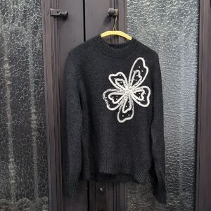 Christina Black Sweater with White Floral Accent